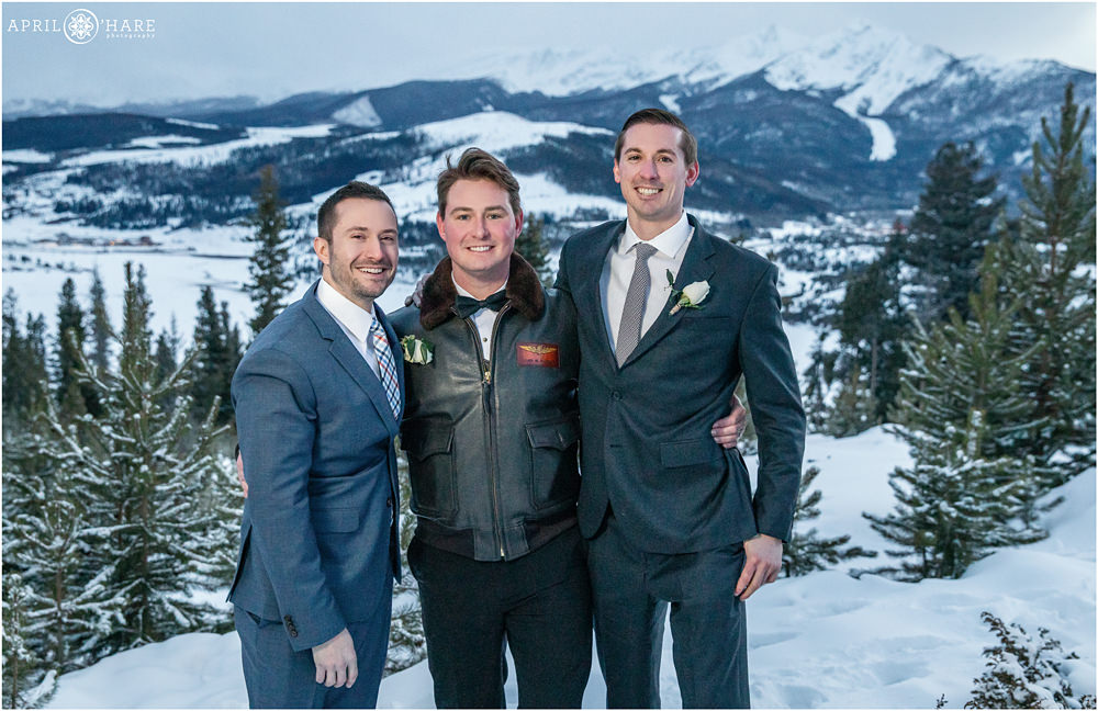 Groom with his groomsmen in the snow at Sapphire Point near Breckenridge Colorado