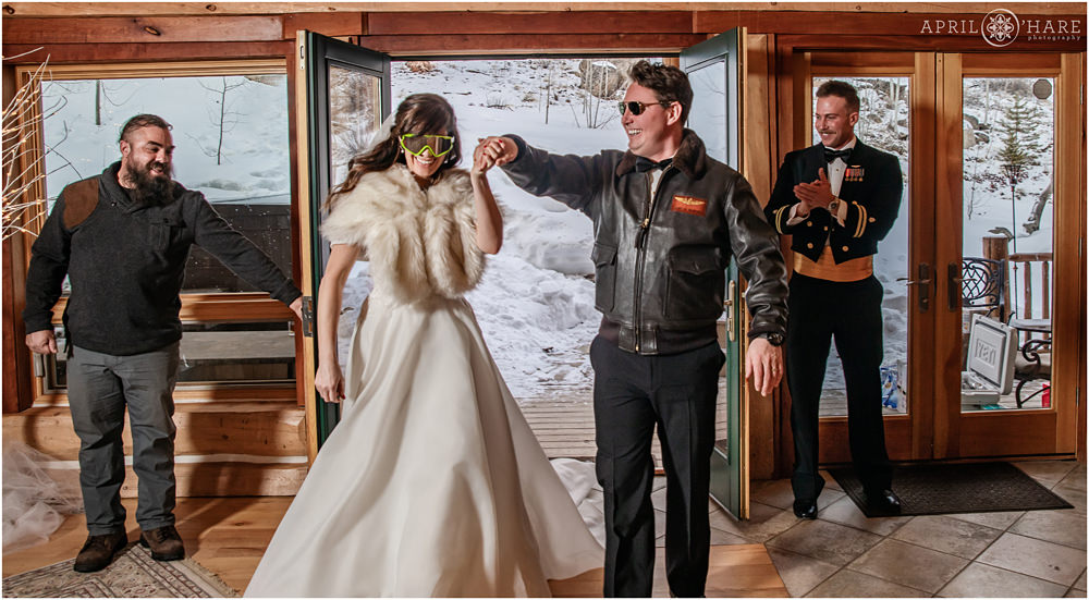 80s style Top Gun wedding entrance at private home at winter wedding in Keystone Colorado