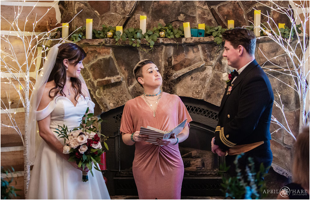 Indoor wedding ceremony inside a mountain cabin private home during winter in Colorado