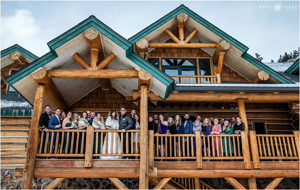 Wedding photo of group of people on balcony at private cabin in Keystone CO