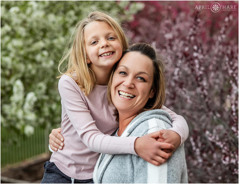 Pretty spring family photos with Tree Blossoms in the backdrop at home in Denver