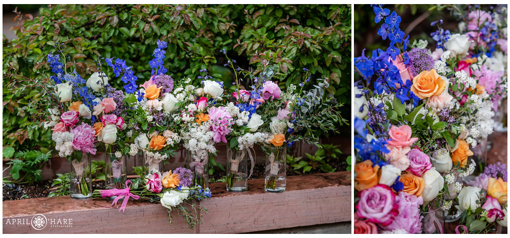 Detail photo of wedding florals with pink, white, blue, and orange colors at Denver Botanic Gardens