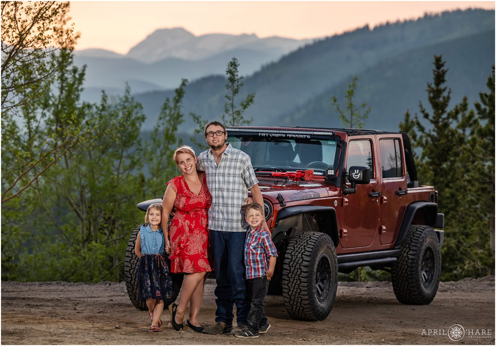 Jeep engagment photos with the couple's kids with pretty mountain views in the backdrop in Colorado