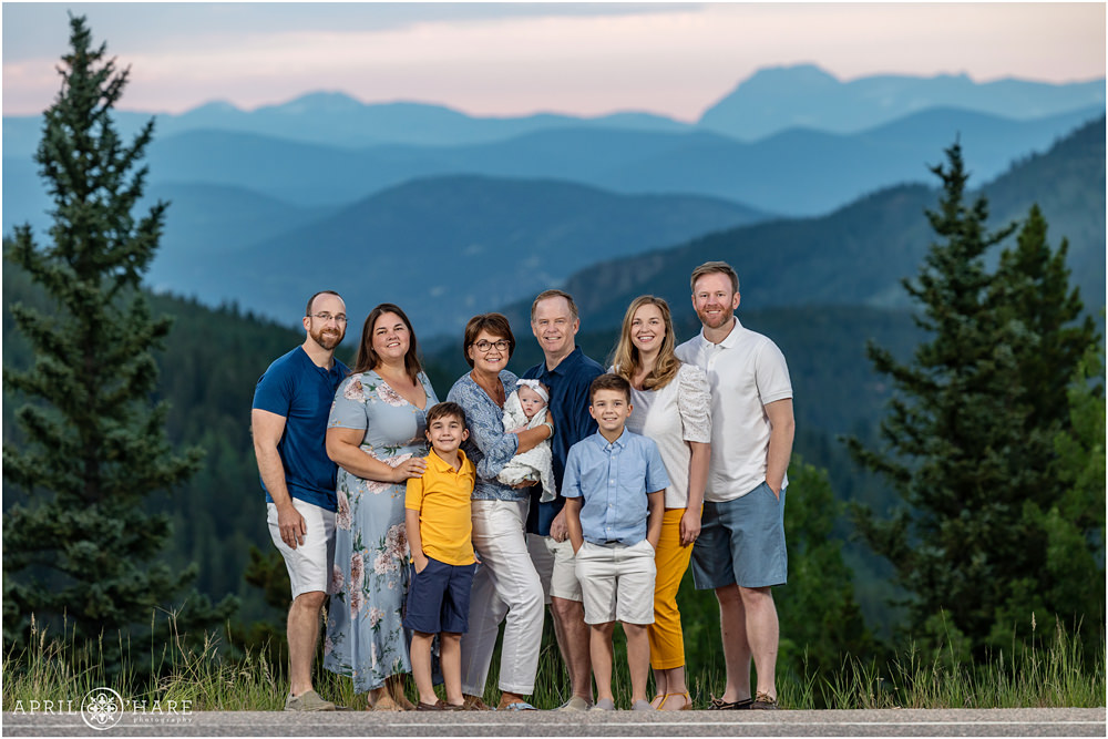 Extended family portrait with a beautiful sunset mountain backdrop on Squaw Pass Road in Colorado