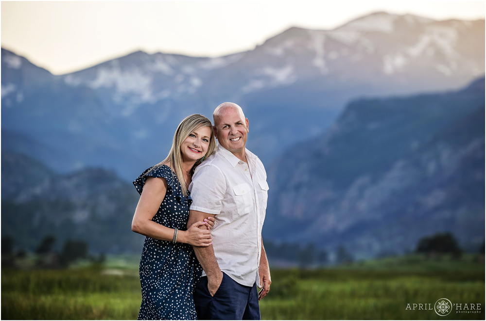 Couples Portrait with pretty sunset mountain backdrop at Moraine Park in Estes Park Colorado