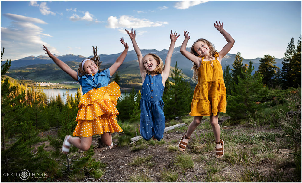 Fun photo of cousins jumping for joy at the end of the night in Summit County Colorado