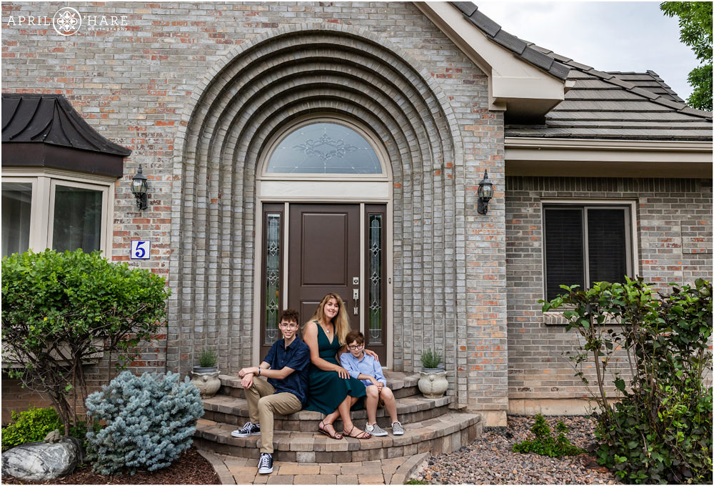 Family portrait on the front steps of their home in Ken Caryl in Colorado
