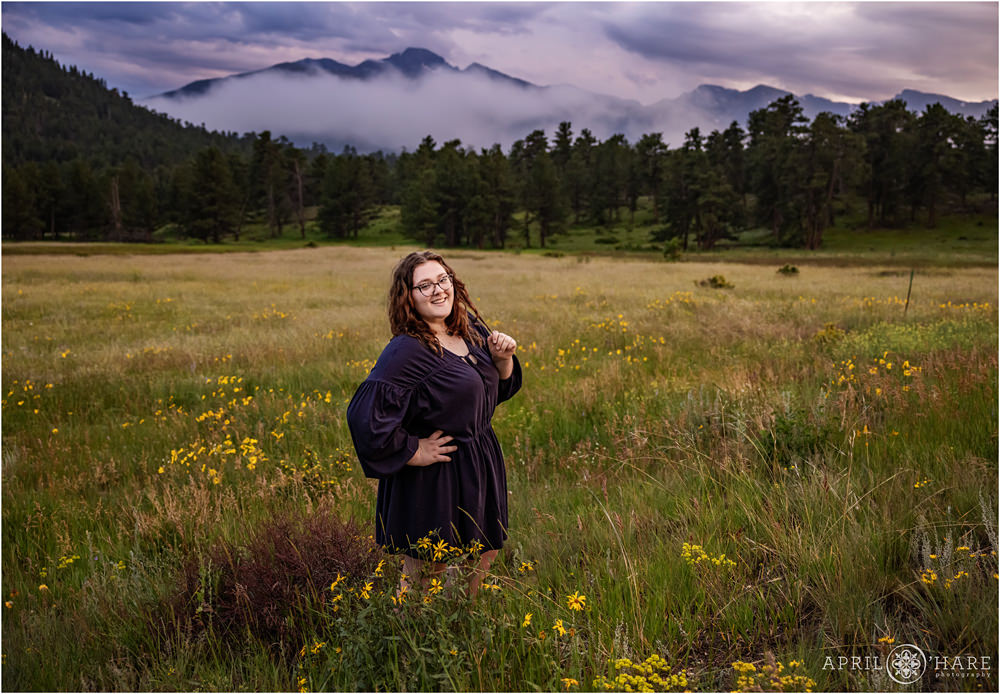 Beautiful misty mountain backdrop on a stormy summer evening for a family photography session in the wildflowers at Rocky Mountain National Park