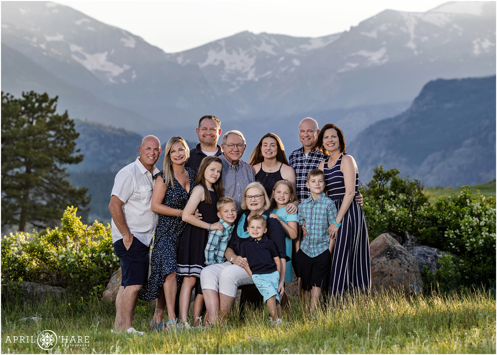 Extended family photo at Rocky Mountain National Park with pretty mountain backdrop in Estes Park Colorado