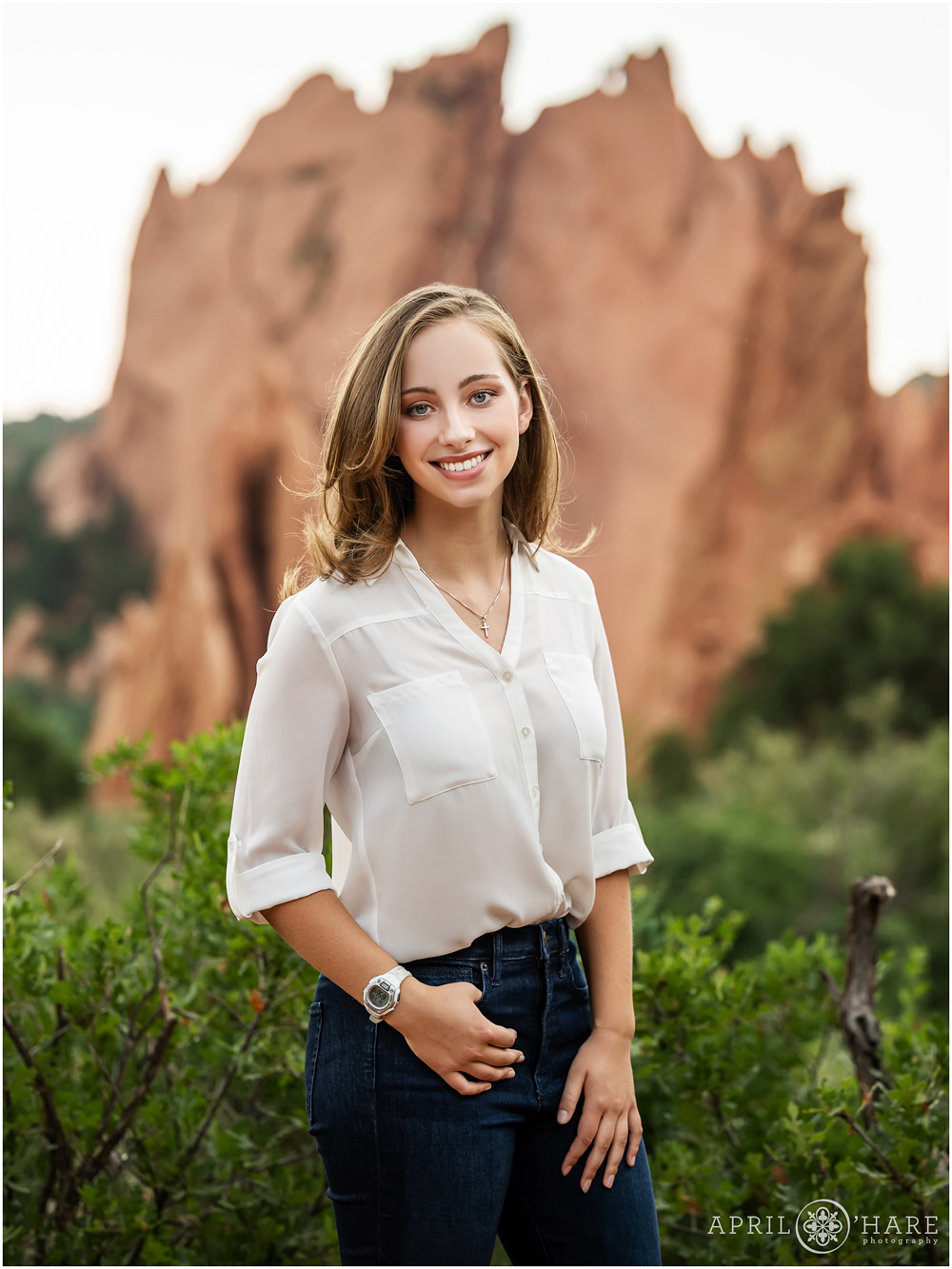 High School senior girl portrait with pretty red rock backdrop at Garden of the Gods in Colorado Springs