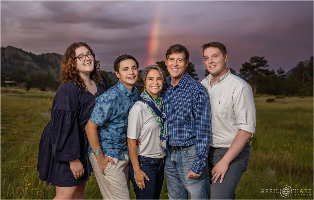 Family photo with a pretty rainbow backdrop at RMNP in Estes Park Colorado