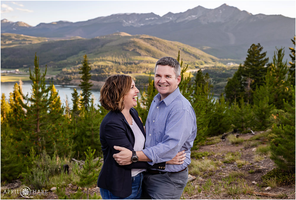 Couple laugh together at their extended family photography session at Sapphire Point in Colorado