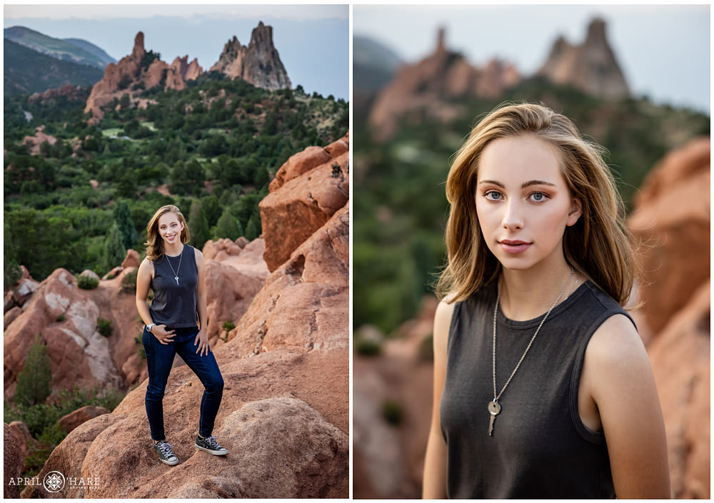 A high school senior girl wearing dark blue jeans and a dark gray tank top poses on the red rocks at High Point at Garden of the Gods in Colorado Springs