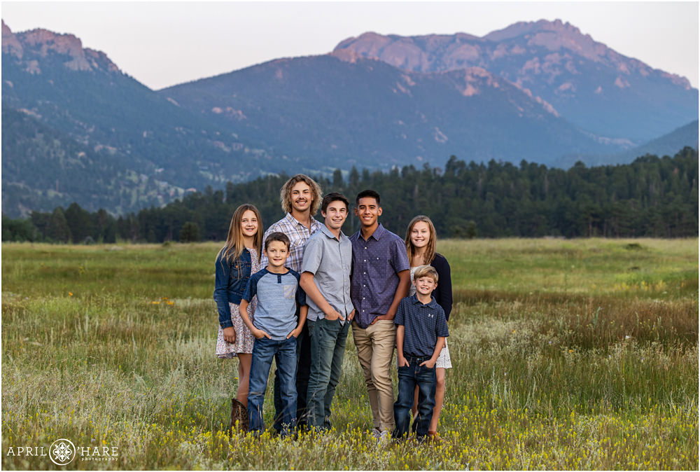 Cousins get a photo together at their extended family portrait session in Moraine Park inside of Rocky Mountain National Park