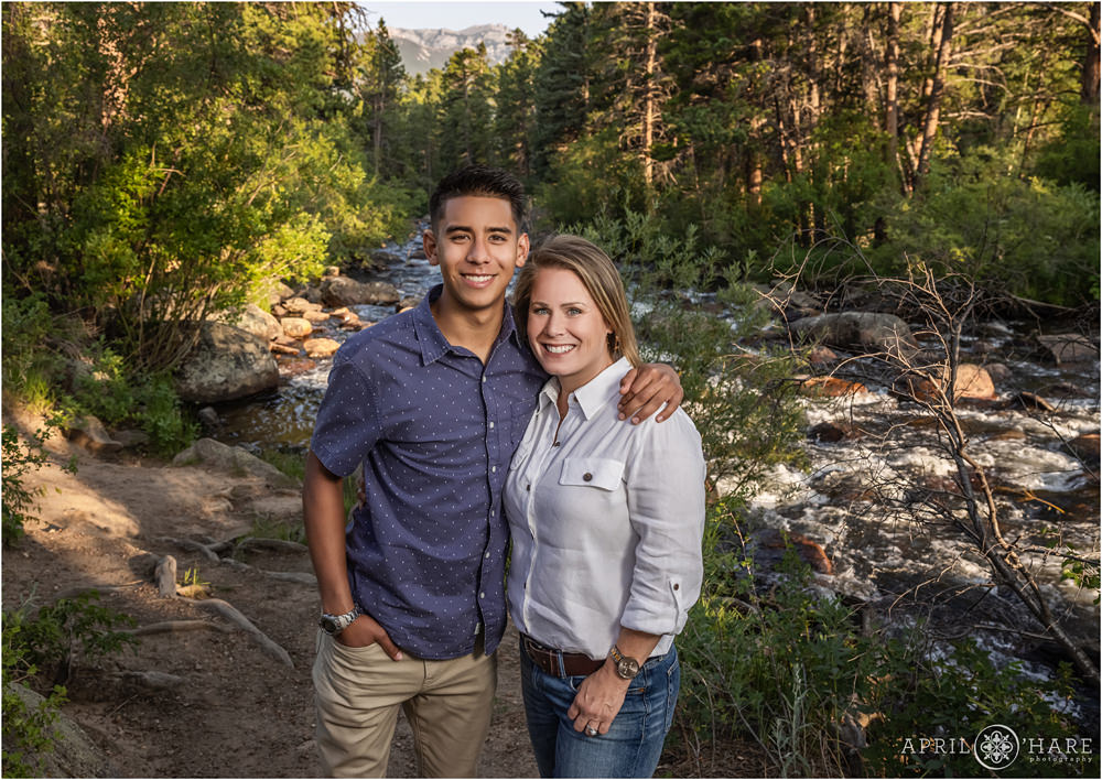 A son poses for a photo with his mom at Rocky Mountain National Park