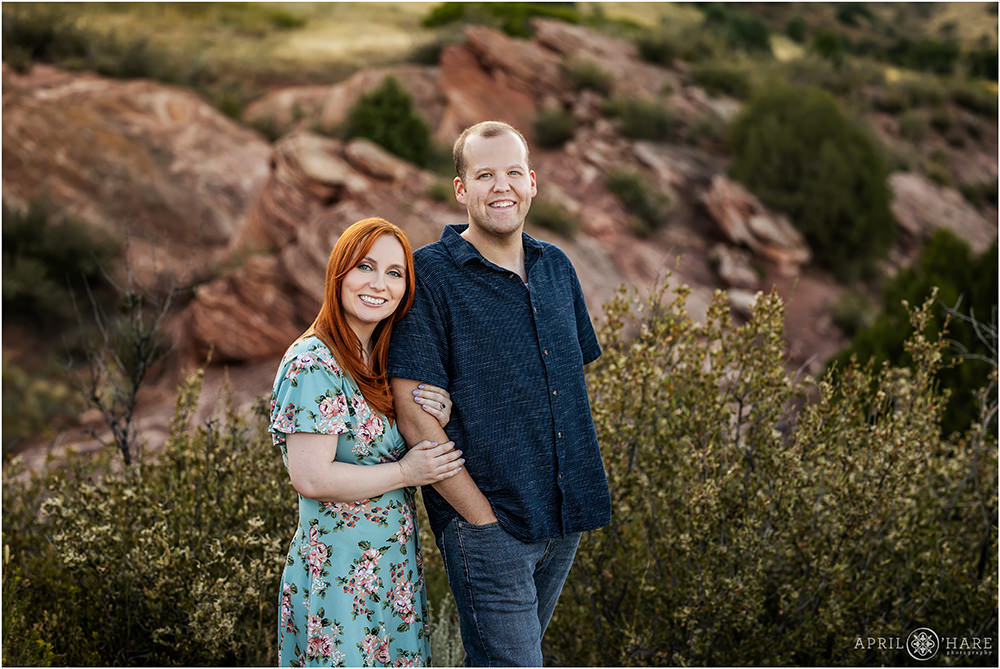 Classic engagement portrait with pretty red rocks backdrop at East Mount Falcon in Morrison Colorado