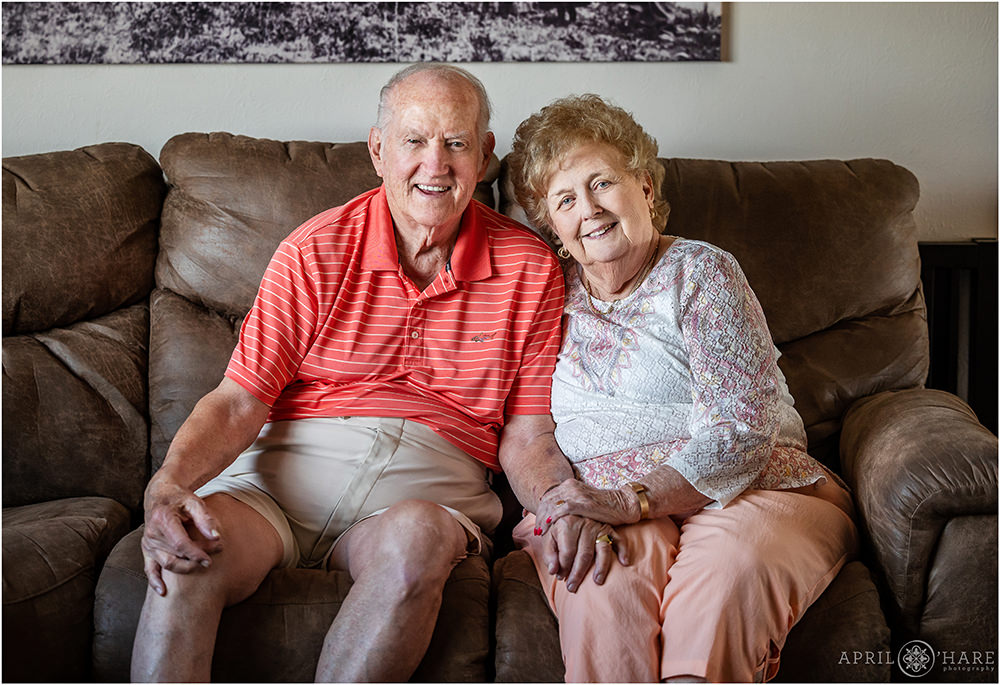 An older couple pose for a portrait inside a home at a family reunion in Elizabeth Colorado