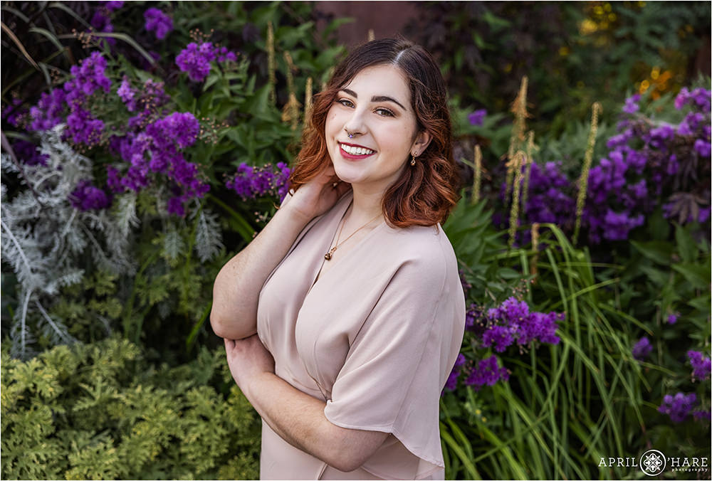 Beautiful deep purple flower backdrop for a girl's senior photoshoot at Denver Botanic Gardens