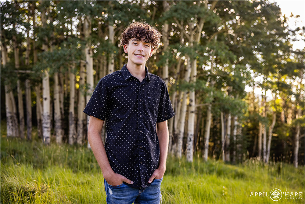 High school senior boy with a lovely aspen tree backdrop in Evergreen Colorado