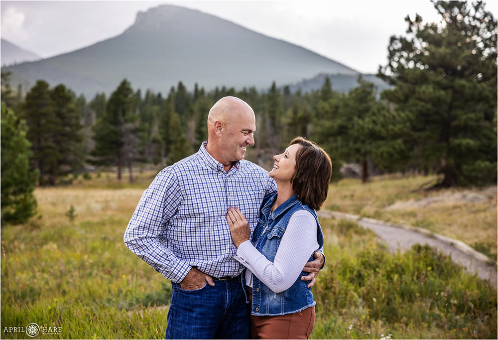 Couple celebrates their wedding anniversary with family photos at Lily Lake in Estes Park Colorado