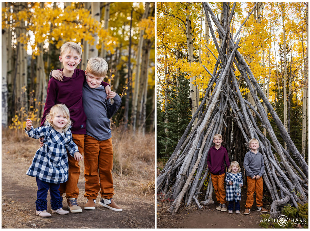 3 young siblings pose with a cute wooden tipi in the fall color of Evergreen Colorado