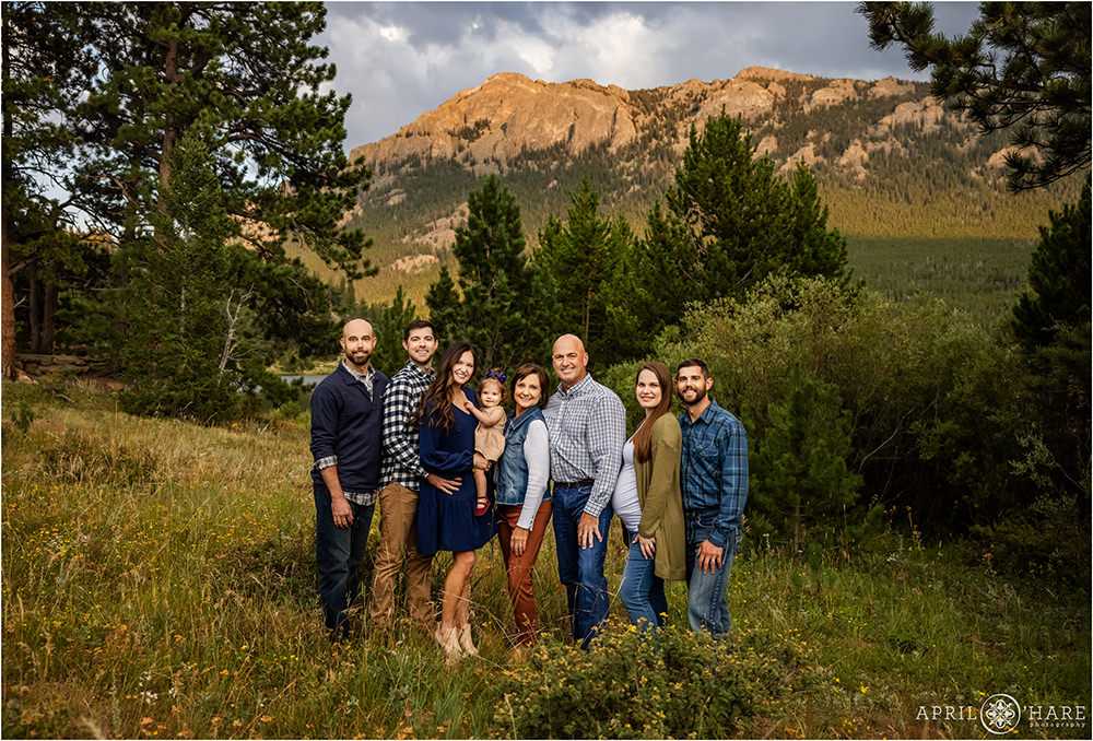 A beautiful extended family photo at sunset at Lily Lake in Estes Park Colorado