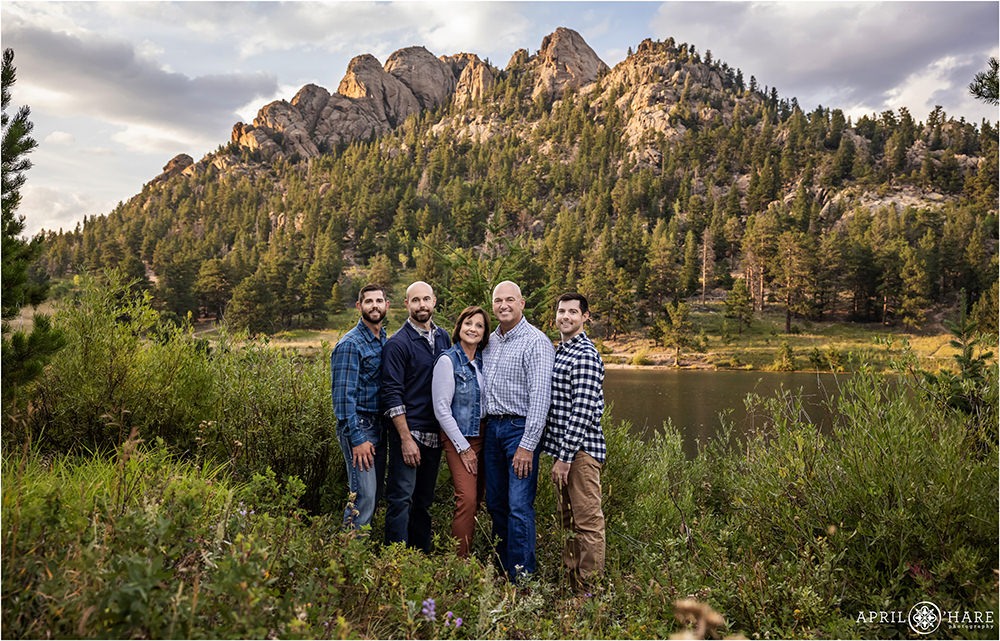 Family of 5 with 3 adult sons pose in the wildflowers at Lily Lake in Estes Park Colorado