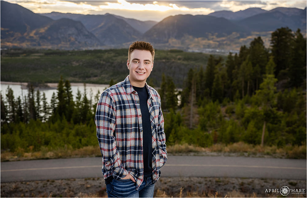 Senior photo for a young man wearing a blue plaid button down flannel shirt at Sapphire Point in Colorado