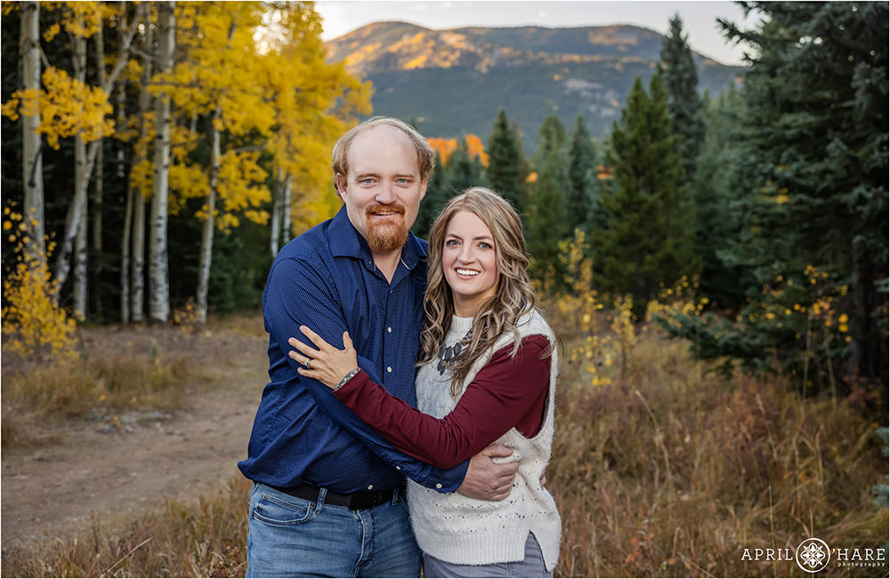 Mom and dad get their own photo together without the kids in the pretty fall color of Evergreen Colorado