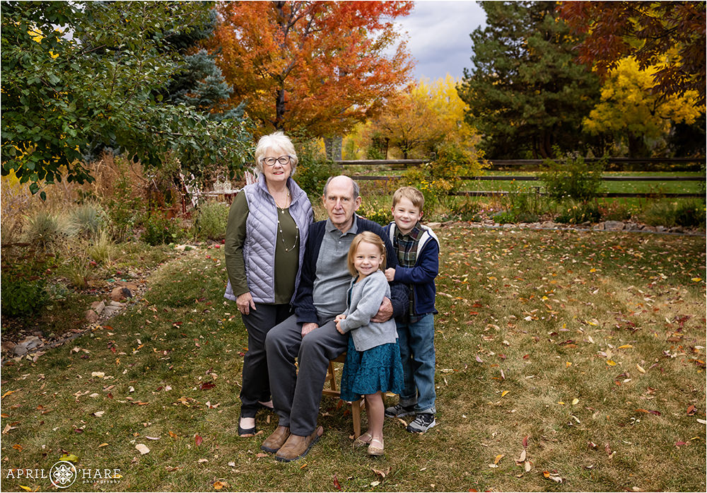 Grandparents with their Grandkids in the backyard during autumn in Denver
