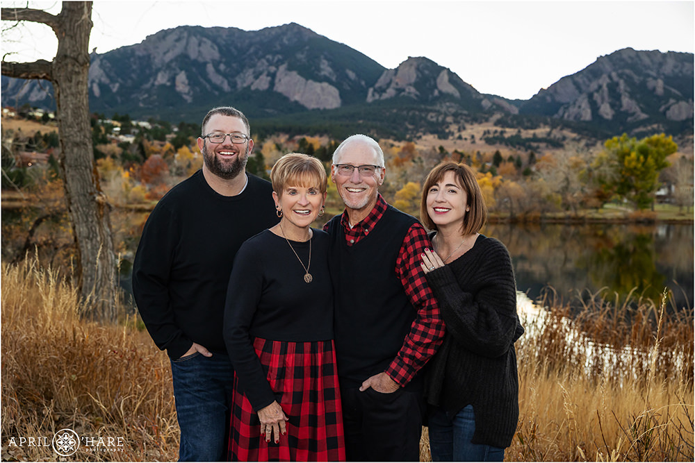 Family of 4 with 2 adult children at Viele Lake in Boulder Colorado during autumn