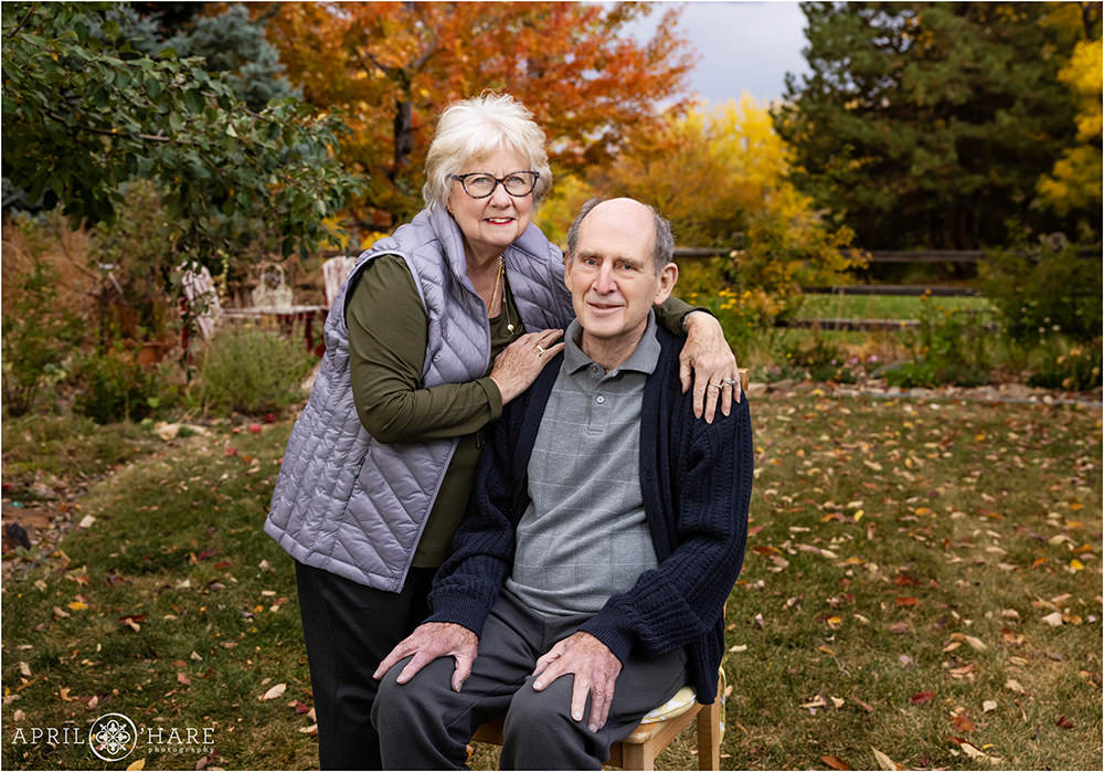 Grandparents together in their backyard during fall in Denver