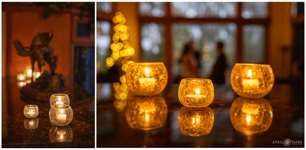 Detail photo of candles lit at an indoor winter wedding in Keystone Colorado