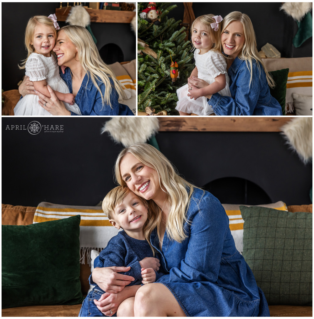 A mom poses for photos with her kids at Denver Photo Collective in front of a cute styled Christmas setting