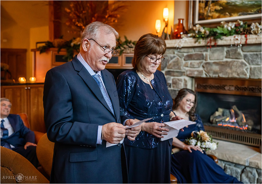 Parents of the bride say some words during wedding ceremony in Keystone Colorado