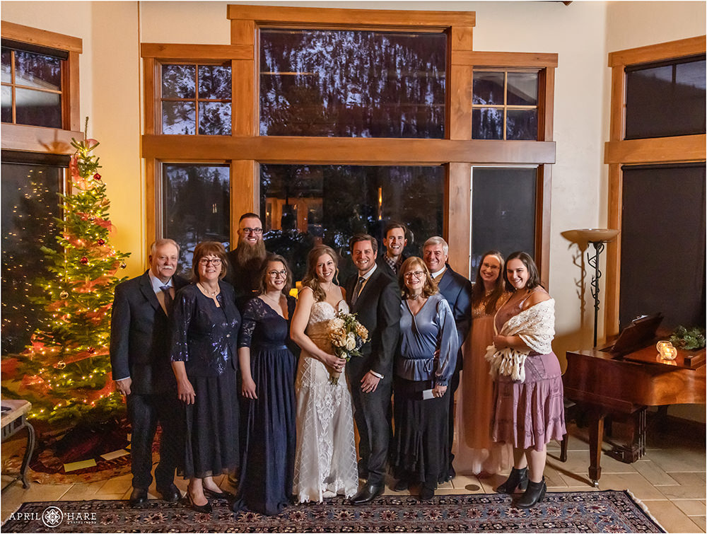 Entire family portrait inside the great room at a Keystone winter wedding in Colorado