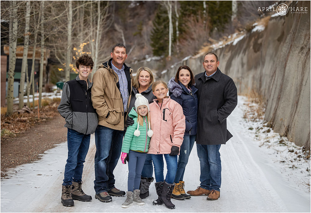 Extended family pose together on their family vacation to Aspen Colorado during winter