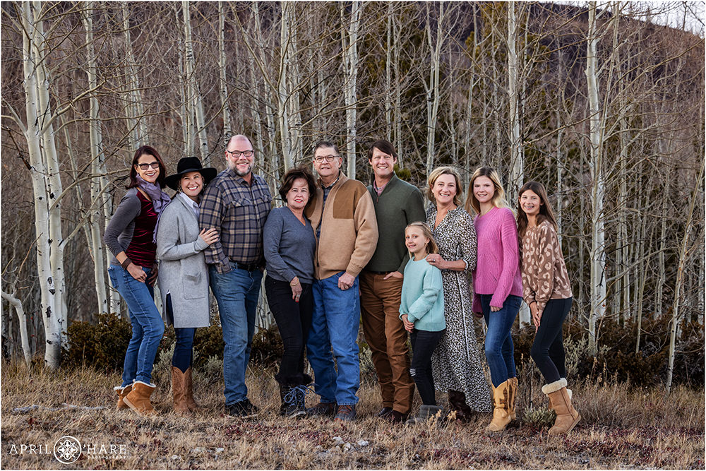 Extended family photo with aspen tree backdrop during November in Colorado