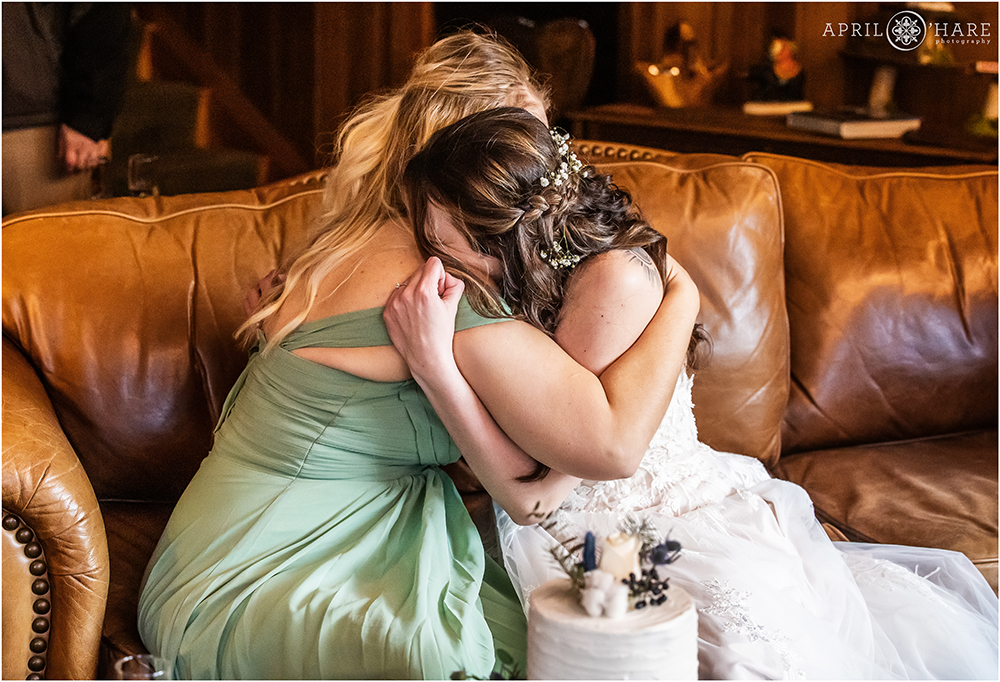 Bride hugs her best friend on her wedding day at Romantic Riversong Inn