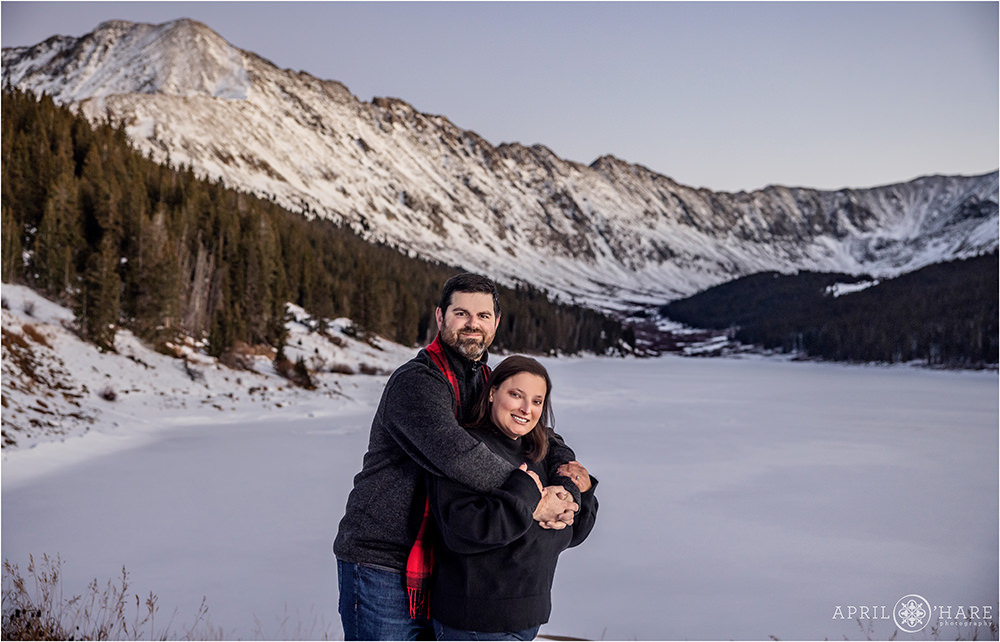 Couples portrait at sunset with rugged mountain backdrop at Clinton Gulch Dam Reservoir near Copper Mountain Ski Resort