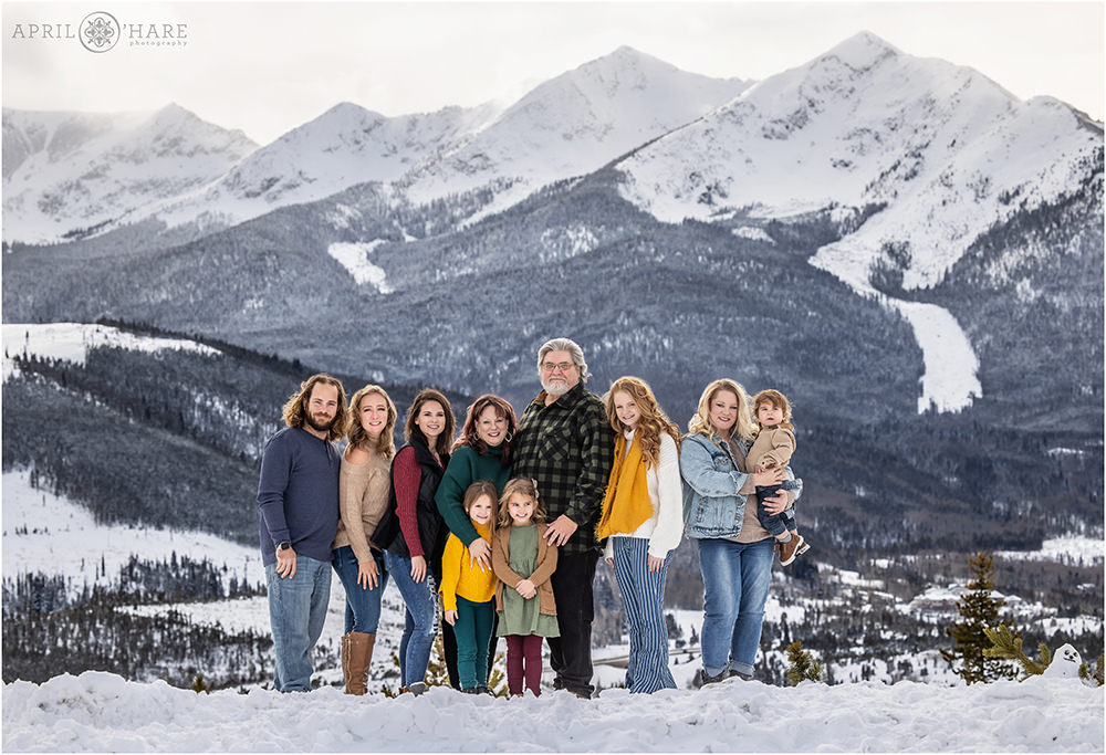 Beautiful extended family portrait with huge mountain backdrop behind them at Sapphire Point