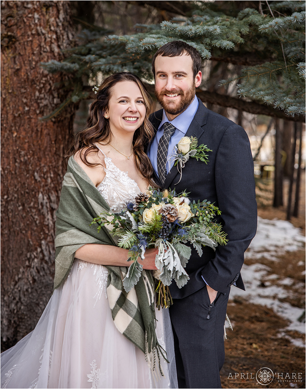 Beautiful outdoor wedding portrait in a forested area of Romantic Riversong Inn in Estes Park Colorado