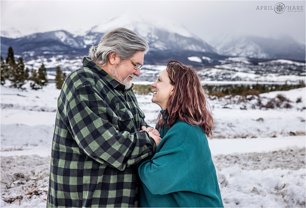 Romantic couples portrait in the snow on a cold chilly day in Colorado