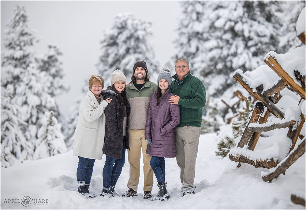 Beautiful family portrait during a winter snowstorm in Colorado