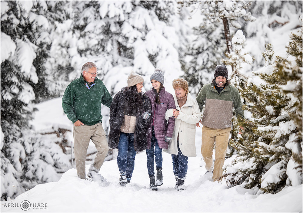 Cute family portrait during a blizzard snowstorm in Colorado