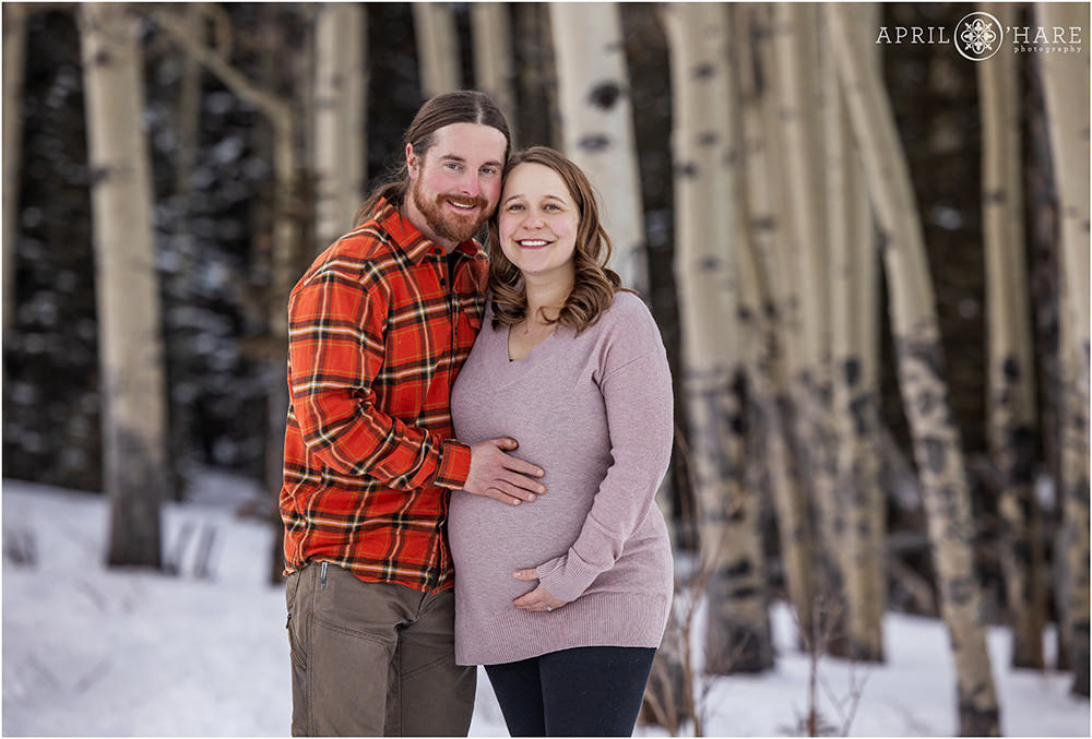 Classic maternity photo in a beautiful Aspen Tree Forest in Evergreen Colorado