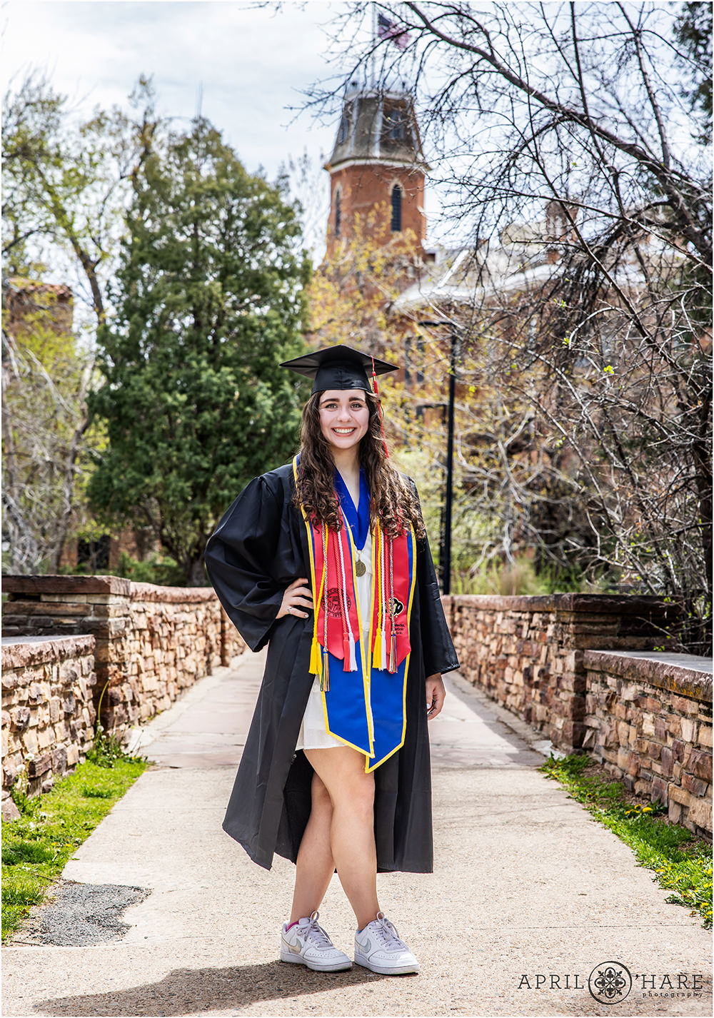 Graduation Portrait at the University of Colorado Boulder Campus on the Bridge at Varsity Lake