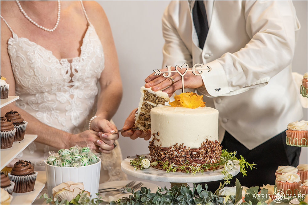 A couple married for 20 years cuts the cake at their Littleton Colorado Vow Renewal