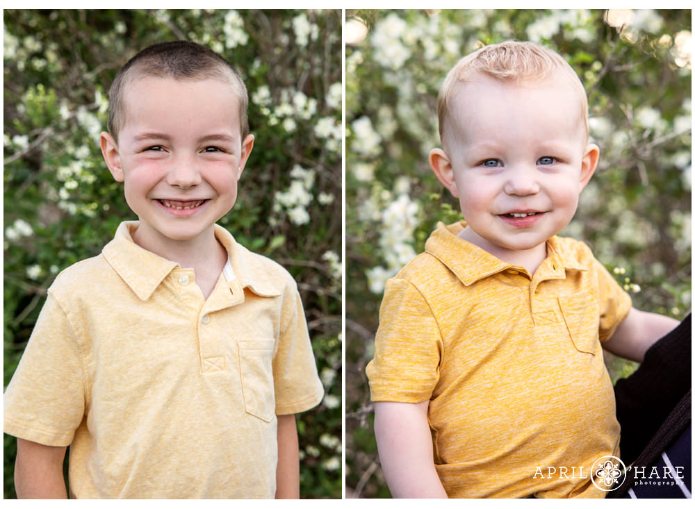 Two brothers get their pictures on a pretty day with spring florals in the backdrop in Lakewood Colorado
