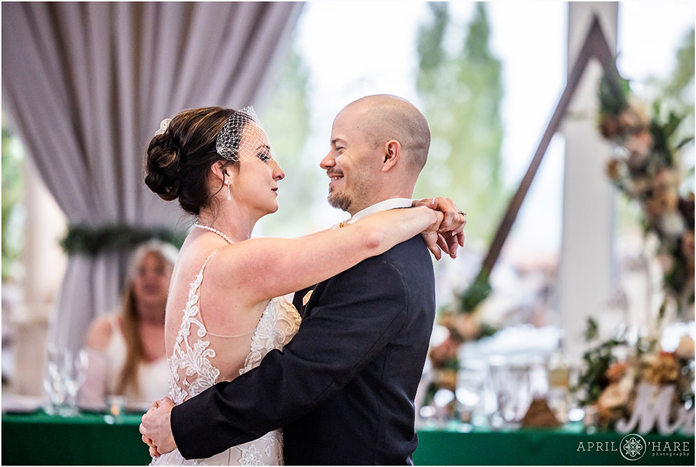 A couple dance their first dance at their Vow Renewal party celebrating 20 years of marriage
